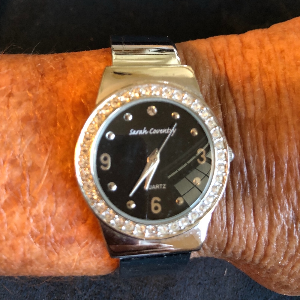 Watch with black face and crystals